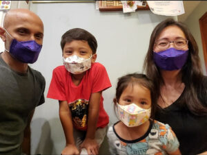 family wearing face masks